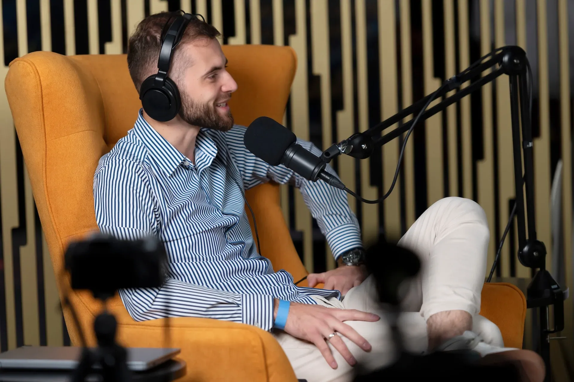 Podcast guest sitting in a chair 