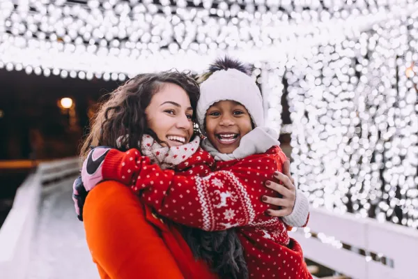 Mother and daughter in the snow 